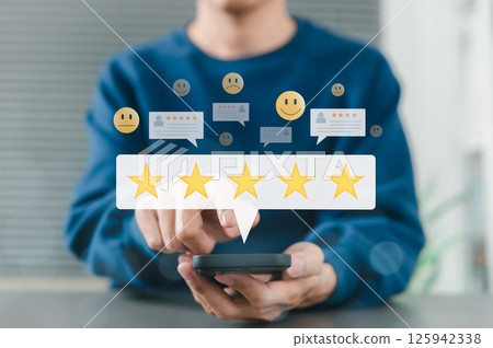Customer review satisfaction feedback concept. Man using smartphone give five star rating, with review icons, emoticons, speech bubbles, online customer feedback, satisfaction, and user experience. 125942338