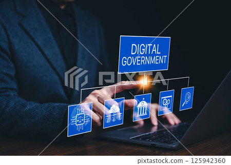 Digital government and e-governance concept. Business professional using laptop with digital government icons, representing e-governance, online public services, and technology-driven administration. Digital government and e-governance concept. Business professional using laptop with digital government icons, representing e-governance, online public services, and technology-driven administration. 125942360