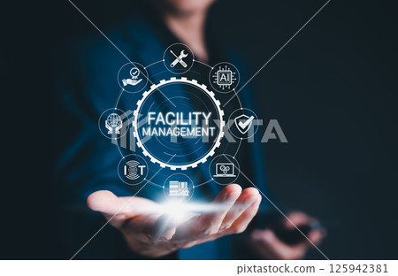 Facility Management Digital Transformation Concept. Business professional presents futuristic facility management system with icon representing maintenance, automation, and infrastructure optimization 125942381