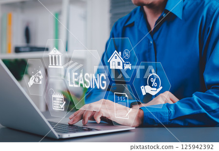 Leasing and Financial Service Concept. Businessman using laptop with icons related to leasing, finance, housing, automotive, interest rates, and monthly payments. lease agreement, leasing car, 125942392