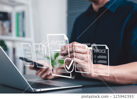 Digital E-Invoice and Billing Management Concept. Businessman using laptop and pen with invoice documents, representing electronic invoicing and digital billing systems. invoice for payment, receipt, 125942393