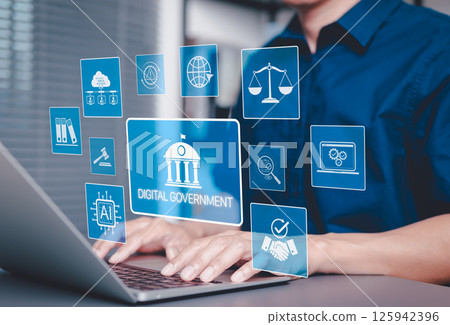 Digital Government and Online Public Services Technology. Man using laptop with icons digital government systems, AI, cloud technology, law, and digital transformation in public administration. 125942396