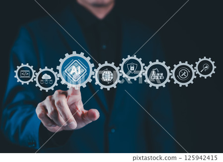 AI, Artificial Intelligence Technology in Digital Workflow. Businessman touches gear icon labeled AI, surrounded by technology icons, illustrating AI integration in digital processes and automation. AI, Artificial Intelligence Technology in Digital Workflow. Businessman touches gear icon labeled AI, surrounded by technology icons, illustrating AI integration in digital processes and automation. 125942415