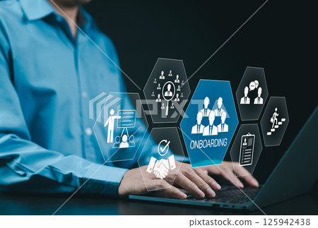 Onboarding new employee process concept. A businessman using laptop with icons representing onboarding process, training, recruitment, communication, hiring, development, and employee integration. 125942438