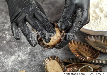 Dough formation. Metal shape Dough formation. Metal shape 125942514