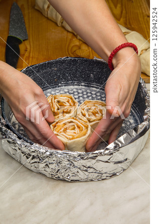The Process of Making Home Apple Pie in Form of Rose The Process of Making Home Apple Pie in Form of Rose 125942524
