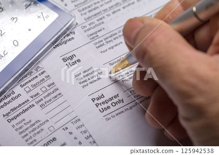 Income tax with instruction. Tax payment and filing concept 125942538