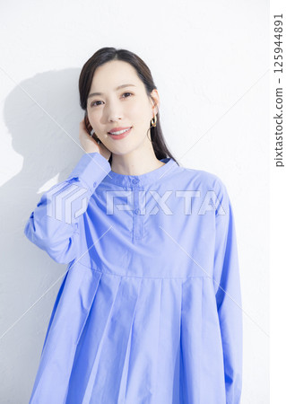 Woman wearing a blue dress Woman wearing a blue dress 125944891