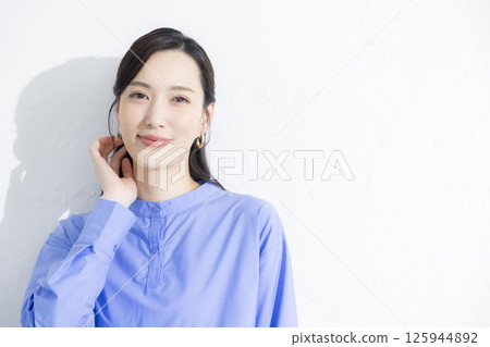 Woman wearing a blue dress Woman wearing a blue dress 125944892