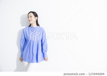 Woman wearing a blue dress Woman wearing a blue dress 125944894