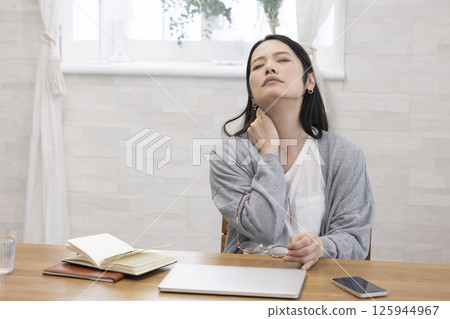 Tired middle-aged woman Tired middle-aged woman 125944967