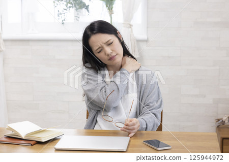 Tired middle-aged woman Tired middle-aged woman 125944972