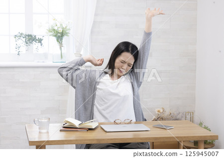 Tired middle-aged woman 125945007