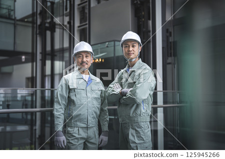 Two workers looking at the camera Building maintenance staff image 125945266