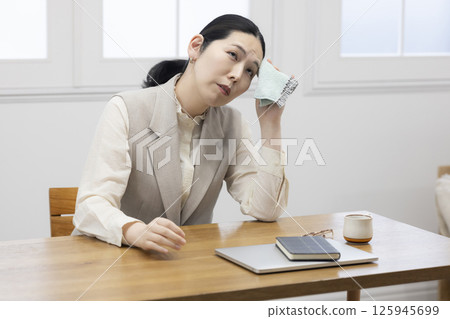 Middle woman who is sick 125945699