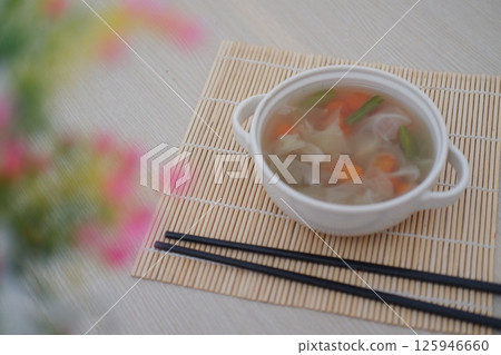 vegetable soup served in a white ceramic bowl 125946660