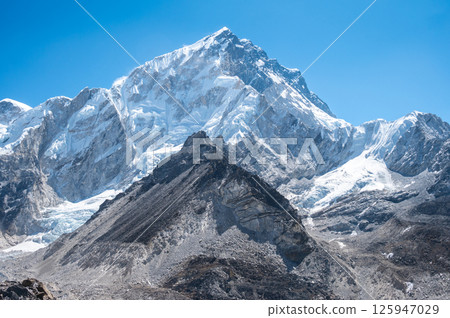 Beautiful view of Mt.Nuptse (7,861 m) on the way to Everest base camp in Nepal. Mount Nuptse is a majestic neighbor to the world's highest peak, Mount Everest. Beautiful view of Mt.Nuptse (7,861 m) on the way to Everest base camp in Nepal. Mount Nuptse is a majestic neighbor to the world's highest peak, Mount Everest. 125947029