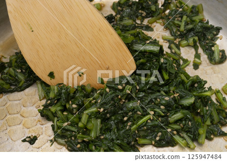 The process of making furikake with leaf radish. Stir-fried leaf radish. Leaf radish furikake. Stir-fried radish leaves. The process of making furikake with leaf radish. Stir-fried leaf radish. Leaf radish furikake. Stir-fried radish leaves. 125947484