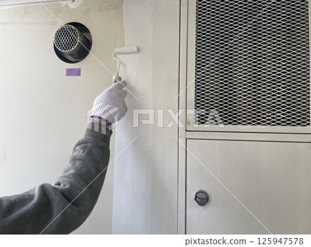Undercoat (rust-proof) painting of MB doors in an apartment building Undercoat (rust-proof) painting of MB doors in an apartment building 125947578