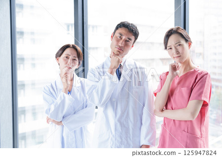 A medical professional thinking A medical professional thinking 125947824