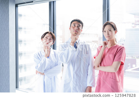 A medical professional thinking A medical professional thinking 125947828