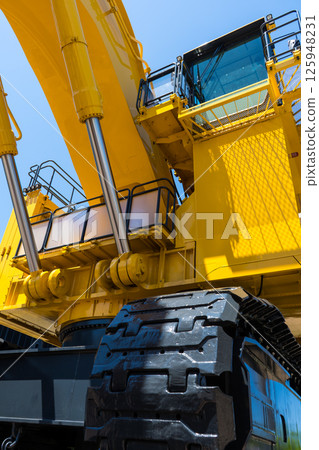 Clear blue skies and large heavy machinery on display in front of Komatsu Station on the Hokuriku Shinkansen line | Hydraulic excavators | Backhoes | Komatsu City, Ishikawa Prefecture 125948231