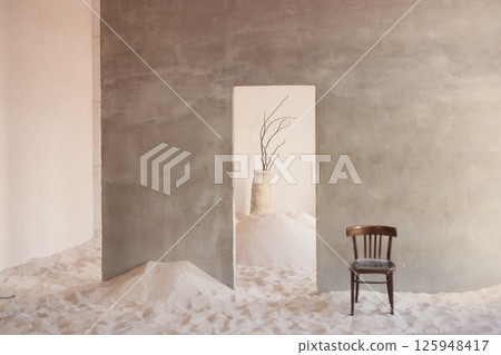 A Minimalist Interior Featuring a Chair Surrounded by Soft Sand Details and Textures A Minimalist Interior Featuring a Chair Surrounded by Soft Sand Details and Textures 125948417