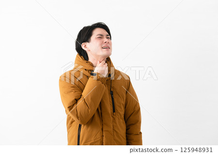 Young man wearing a down coat Young man wearing a down coat 125948931