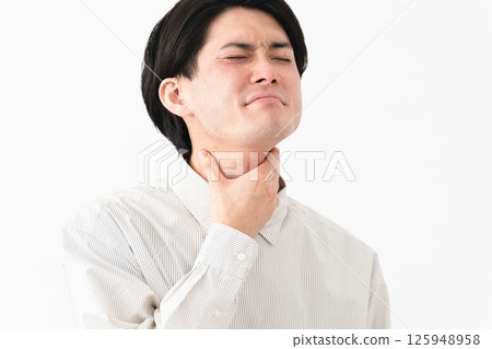 Young man wearing a long-sleeved white shirt Young man wearing a long-sleeved white shirt 125948958