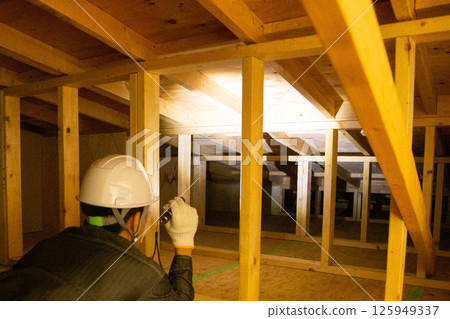 A trader who works in the attic of a house A trader who works in the attic of a house 125949337