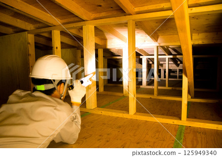 A trader who works in the attic of a house A trader who works in the attic of a house 125949340