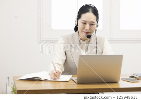 Women studying online Women studying online 125949613