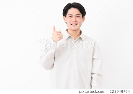 Young man wearing a long-sleeved white shirt Young man wearing a long-sleeved white shirt 125949764