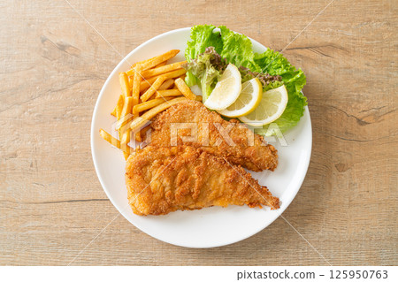 Homemade Breaded Weiner Schnitzel with Potato Chips Homemade Breaded Weiner Schnitzel with Potato Chips 125950763