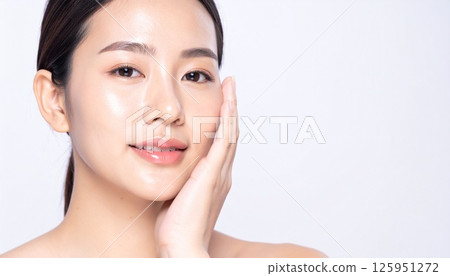 A woman with her hands on her face A woman with her hands on her face 125951272