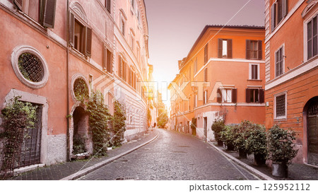 Warm Light on a Cobblestone Street in an Old Town 125952112