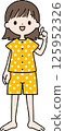 A woman with short hair and a pajama top is pointing 125952326
