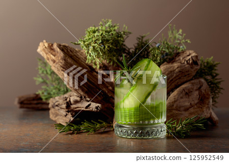Refreshing hard seltzer with ice, cucumber, and rosemary. Refreshing hard seltzer with ice, cucumber, and rosemary. 125952549