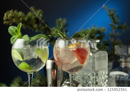Cocktails gin and tonic with grapefruit and lime slices. Cocktails gin and tonic with grapefruit and lime slices. 125952561
