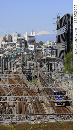 "Tokyo Fujimisaka" at the Ookayama Campus of Tokyo University of Science, with a train running through the intersection of the Tokyu Oimachi Line and Meguro Line and Mount Fuji 125952905