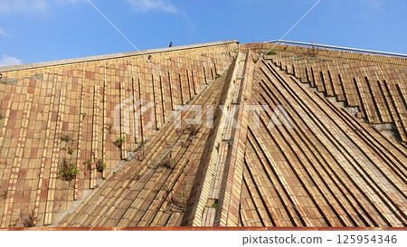 A glimpse of one of the brick pyramids in Naples just outside the city center. A glimpse of one of the brick pyramids in Naples just outside the city center. 125954346
