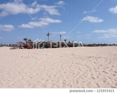 Umbrellas on beach in African Santa Maria town at Sal island in Cape Verde Umbrellas on beach in African Santa Maria town at Sal island in Cape Verde 125955423