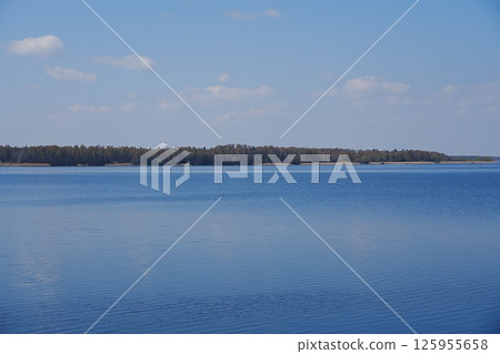Shore on horizon at lake in Goczalkowice town in Poland Shore on horizon at lake in Goczalkowice town in Poland 125955658