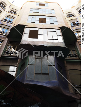 Facade in patio in historical building in European BARCELONA city in Spain - vertical 125955692