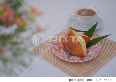 teamed or baked sponge cake with a golden-brown crust and fluffy interior teamed or baked sponge cake with a golden-brown crust and fluffy interior 125955880