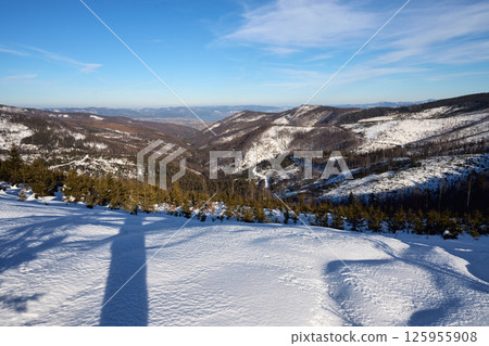 Snowy field at Silesian Beskid near Bialy Krzyz pass, Poland 125955908