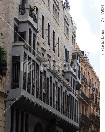 Elevation of palace in European Barcelona city in Spain - vertical 125955921