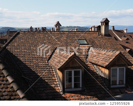 Windows on roof of European Murten town in Switzerland Windows on roof of European Murten town in Switzerland 125955926