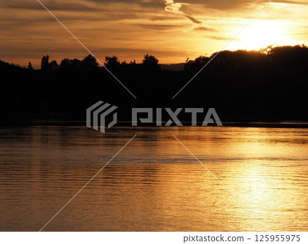 Golden sun set over Rhine River near Stein am Rhein in Switzerland 125955975