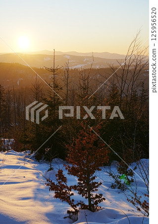 Sun set over Silesian Beskid near Bialy Krzyz, Szczyrk in Poland - vertical Sun set over Silesian Beskid near Bialy Krzyz, Szczyrk in Poland - vertical 125956520